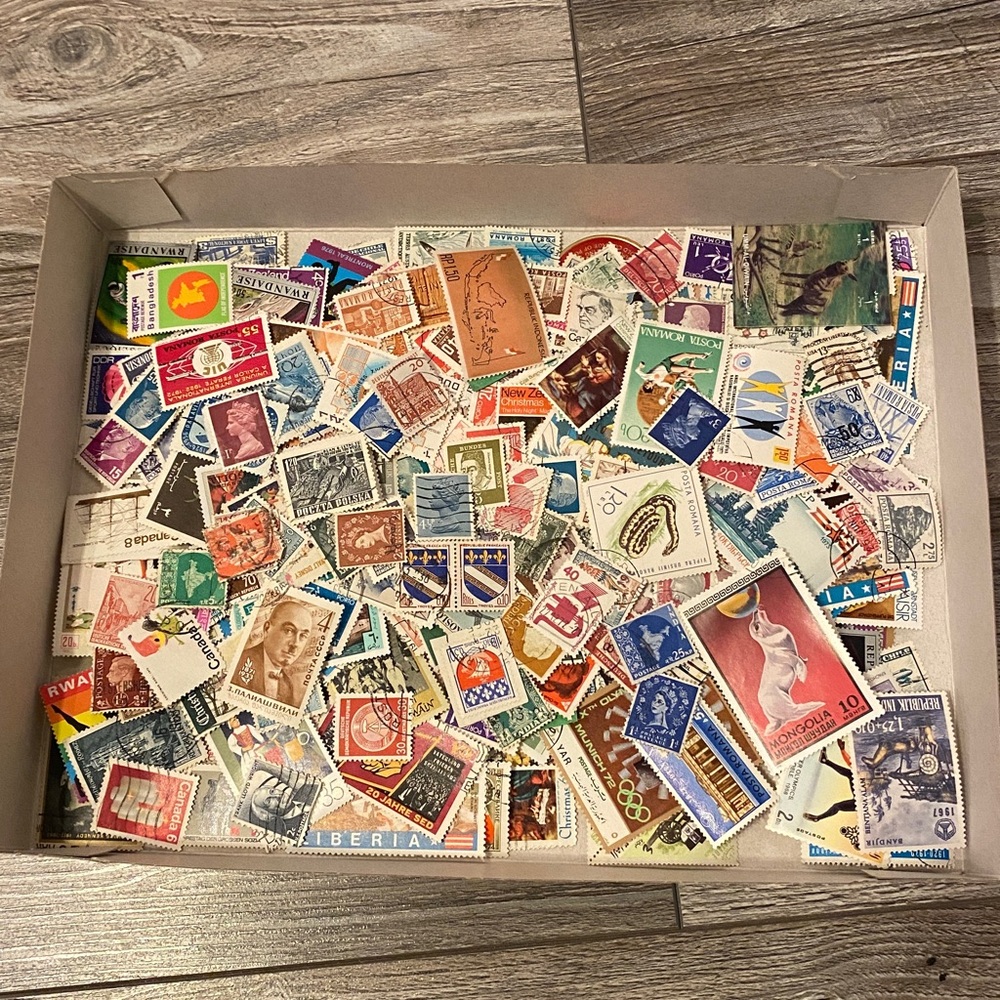 200 plus random used postage stamps